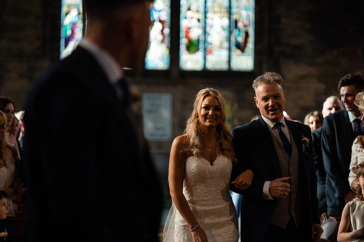 bride smiling at her groom