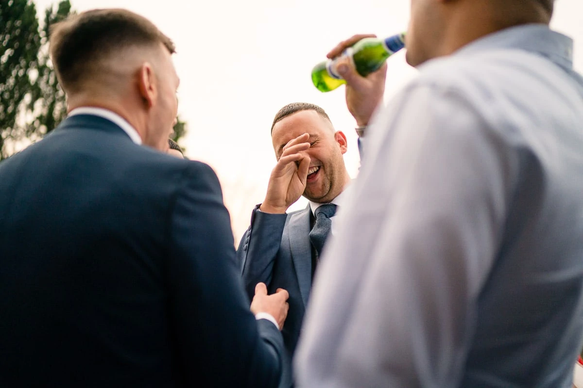 wedding guest laughing