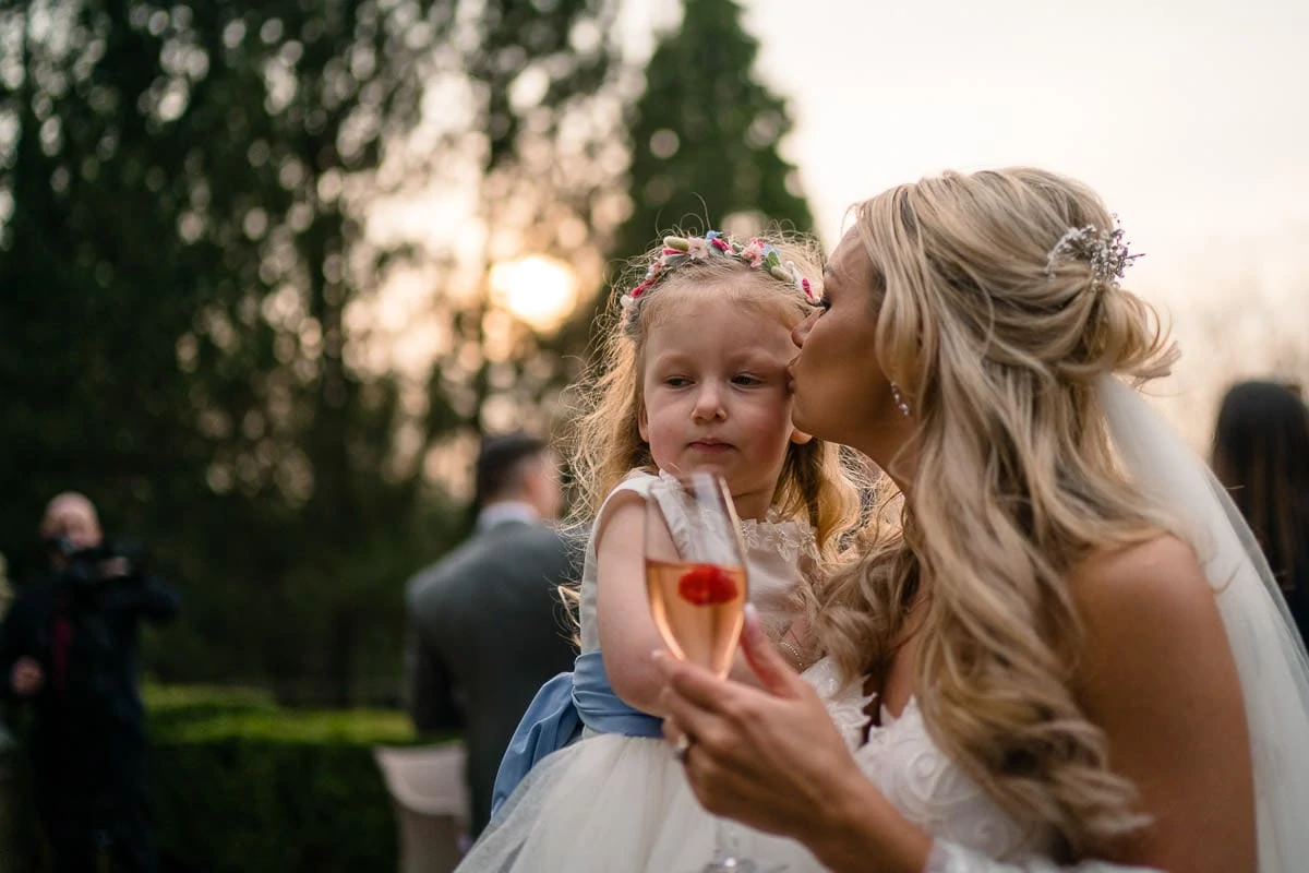 bride kissing her daughter