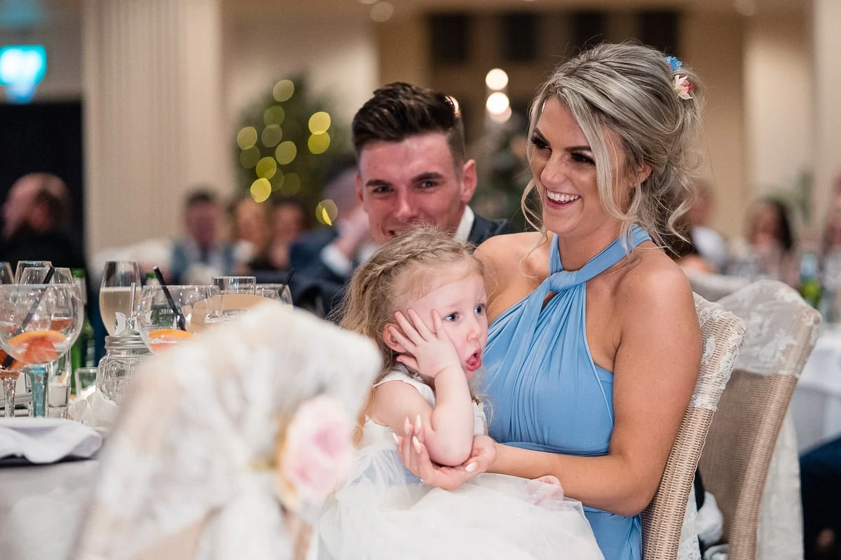 laughing wedding guests