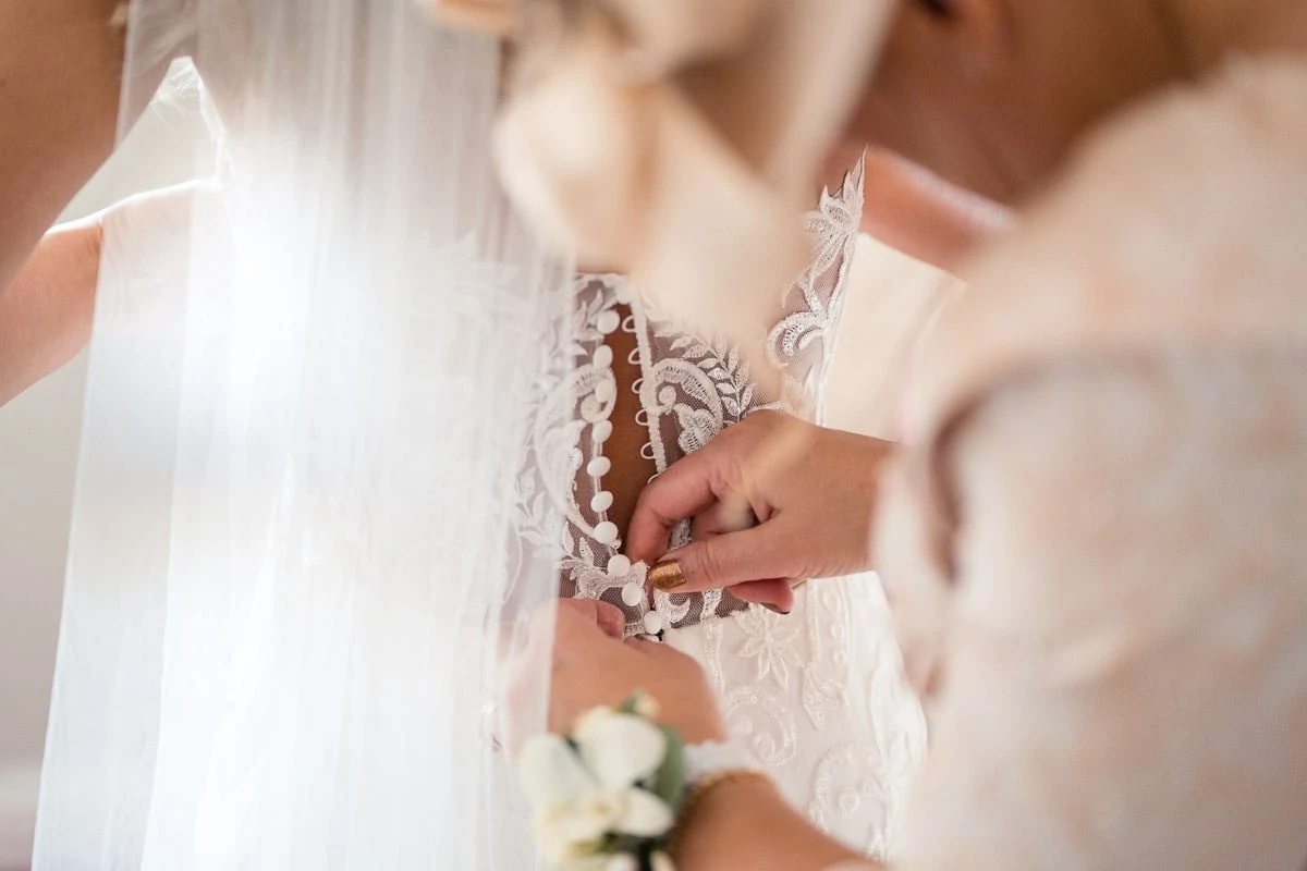 bride getting in her dress