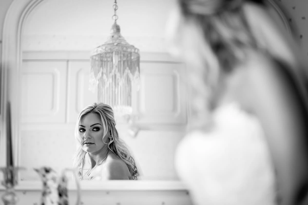 bride looking in a mirror