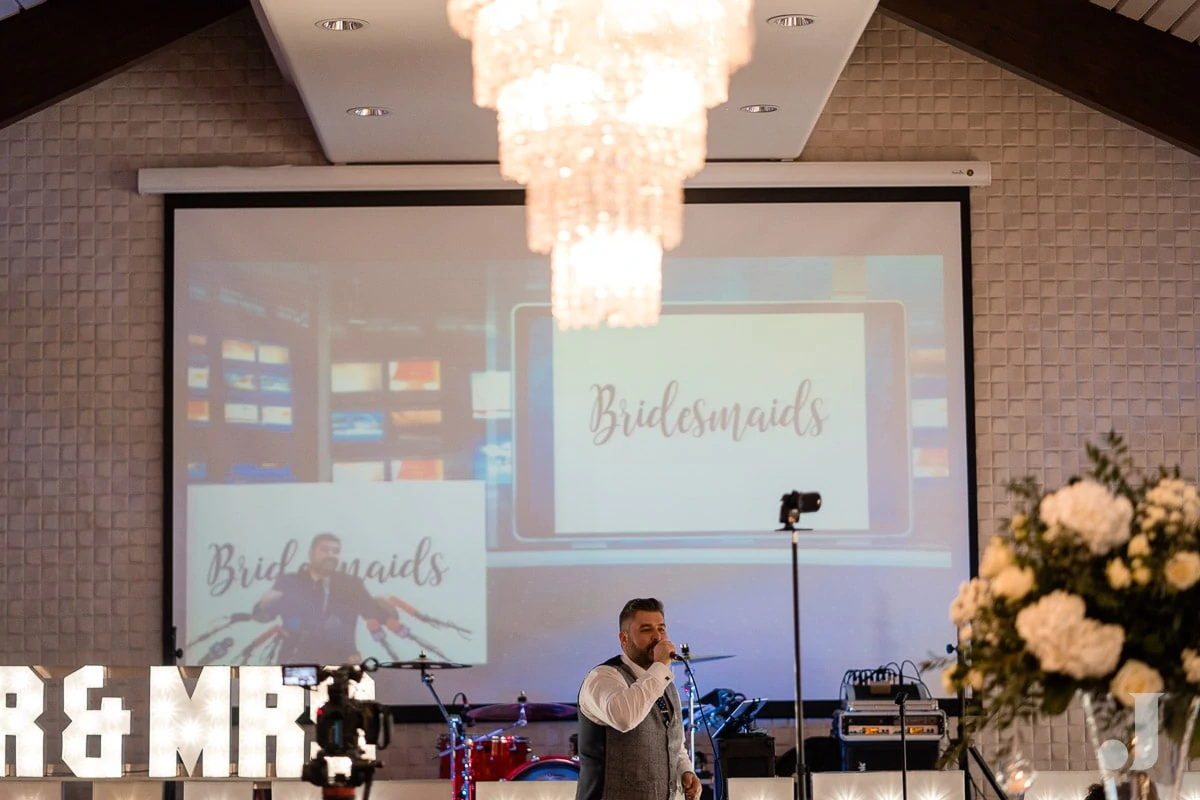 wide shot of groom speech