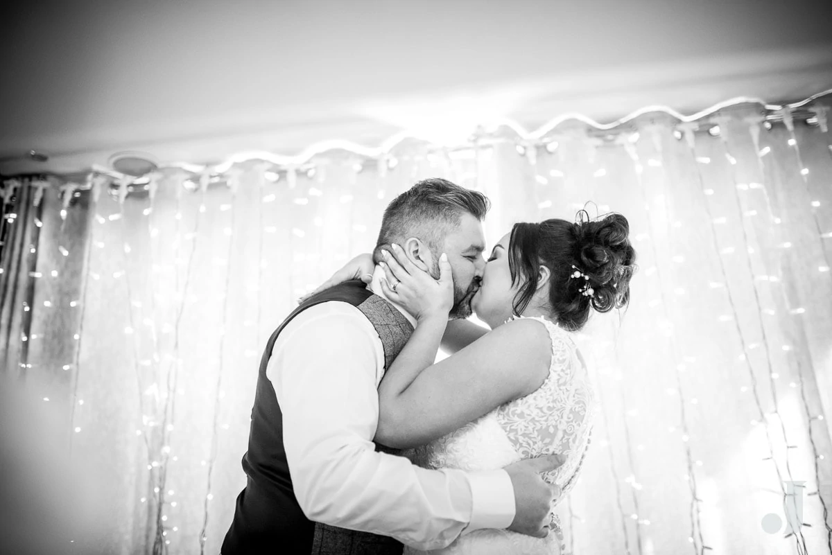 bride kissing her husband after the speech