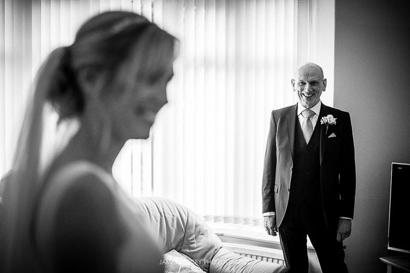 father of the bride seeing his daughter for the first time wedding at the plough inn at hathersage