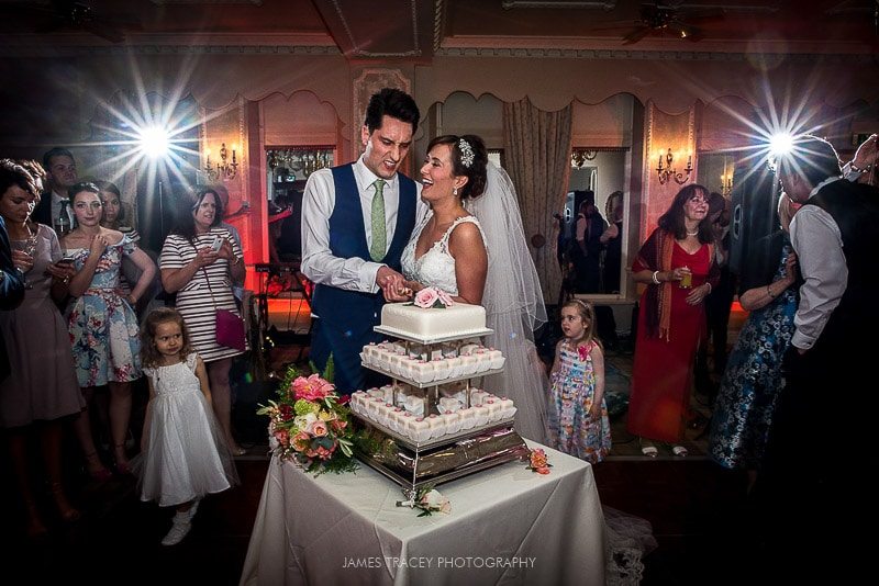 bride and groom cutting the wedding cake merewood country house wedding photography