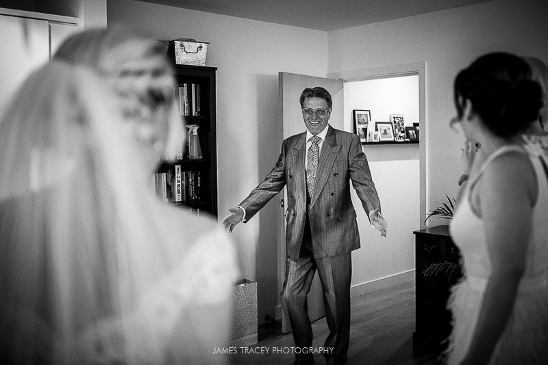 father seeing daughter in wedding dress