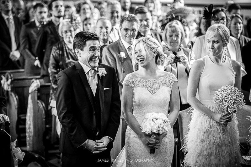 bride and groom smiling at church