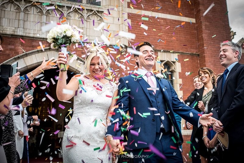 bride and groom being showered in confetti