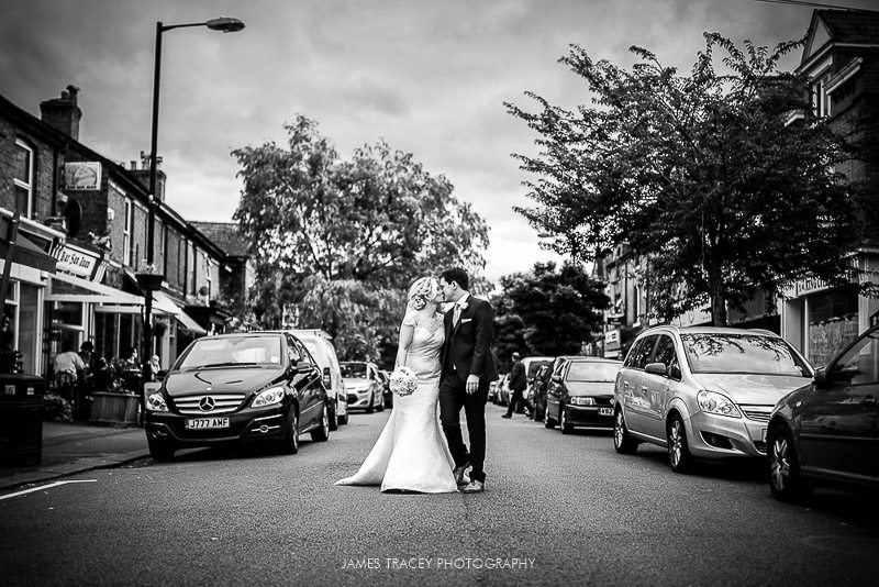 bride and groom walking in middle of the road