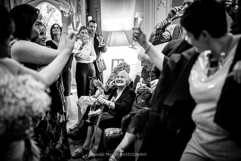 grooms mum being toasted by wedding guests