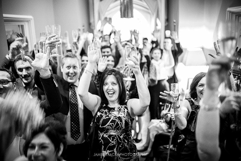 guests toasting bridal couple