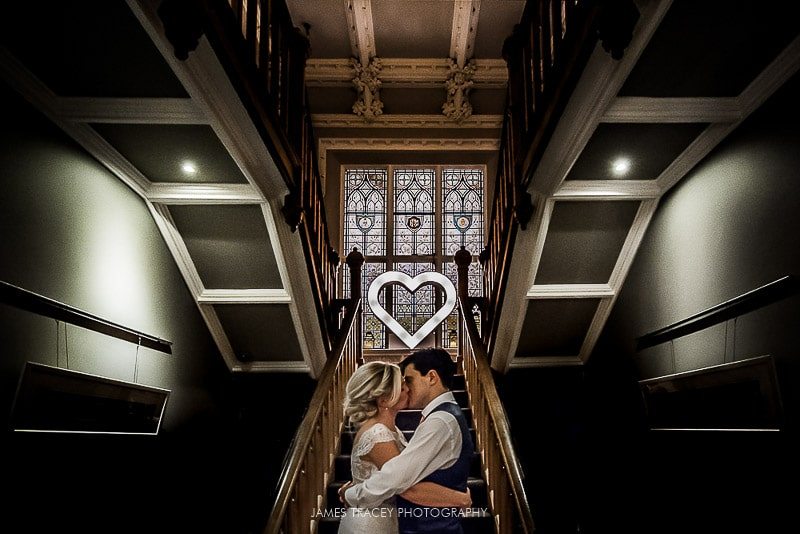 bride and groom kissing at didsbury house hotel