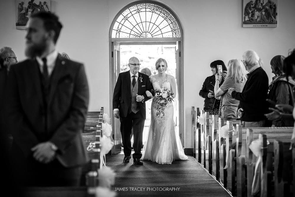 bride walking up the ailse