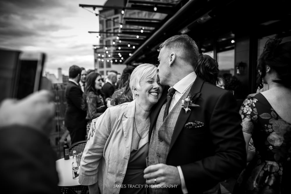 groom kissing his mother at king street townhouse