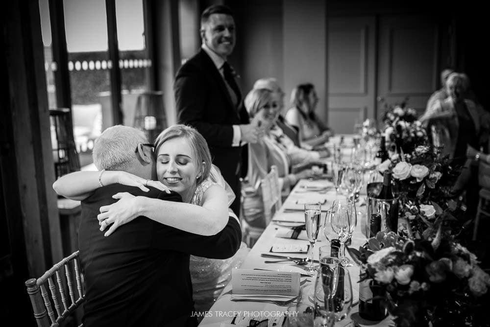 bride hugging her father at king street townhouse