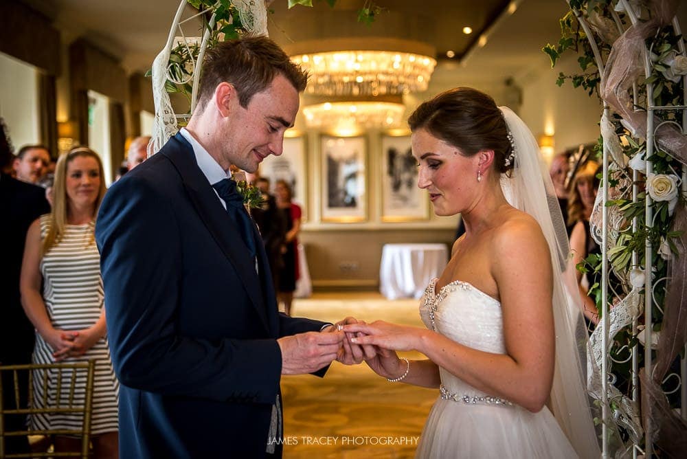 exchange of wedding rings at wedding at the mansion leeds