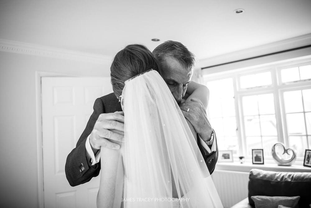 brides dad hugging her