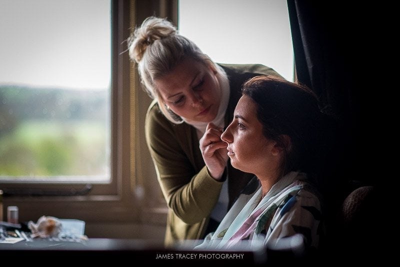 bride having make up applied