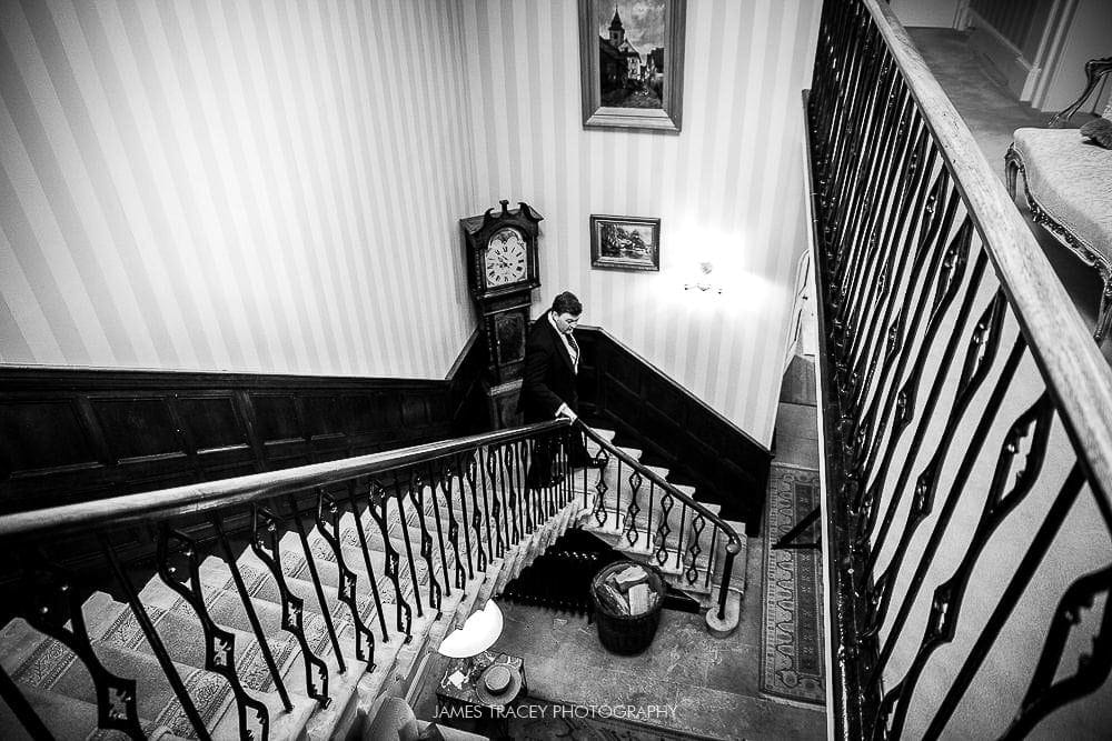 groom walking down stairs