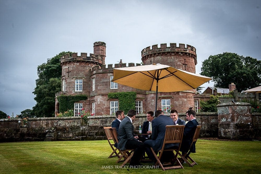 wedding guests braving the rain outside the citadel