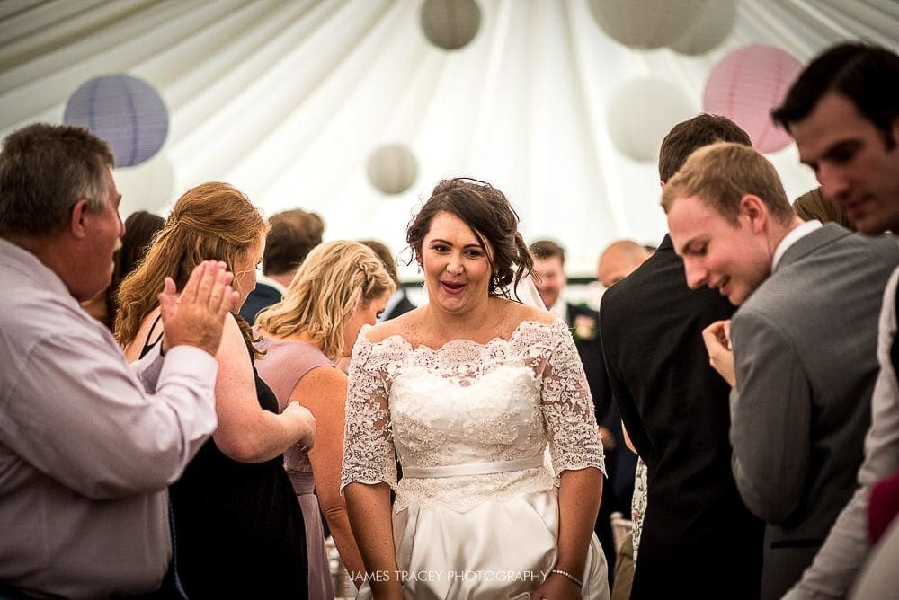 bride walking into reception