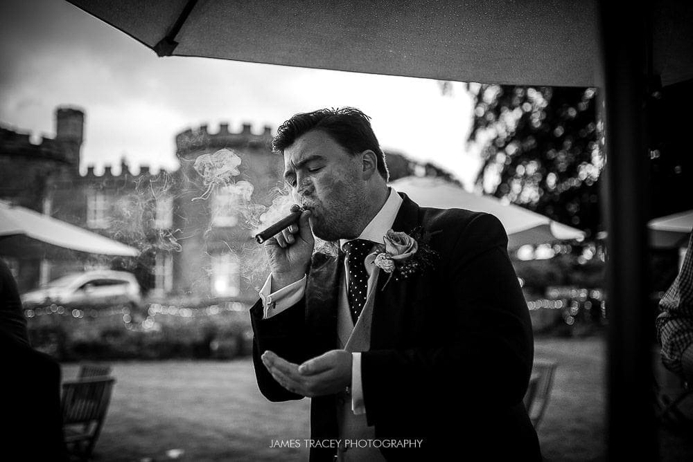 groom smoking a cigar