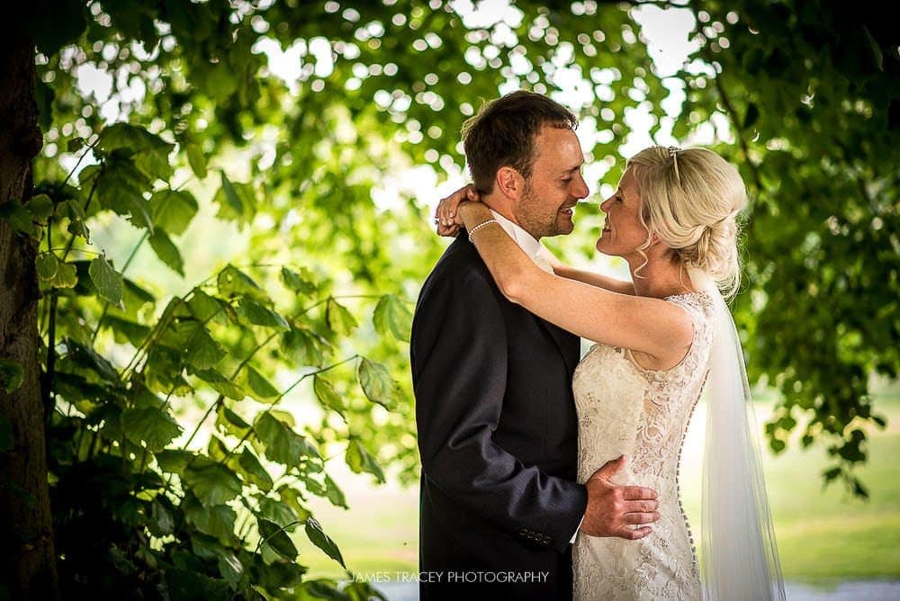 bride and groom in trees