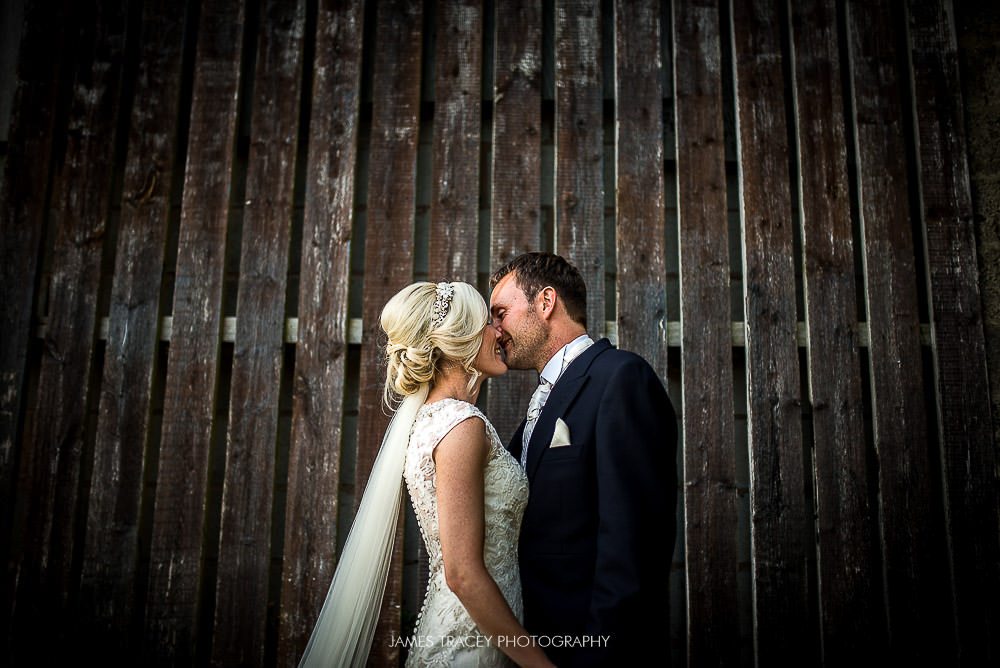 bride and groom and wooden door