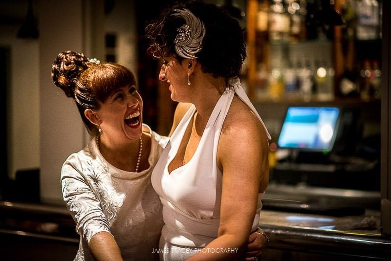 same sex brides laughing