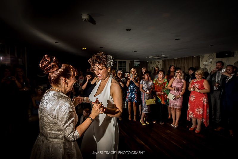 two brides dancing