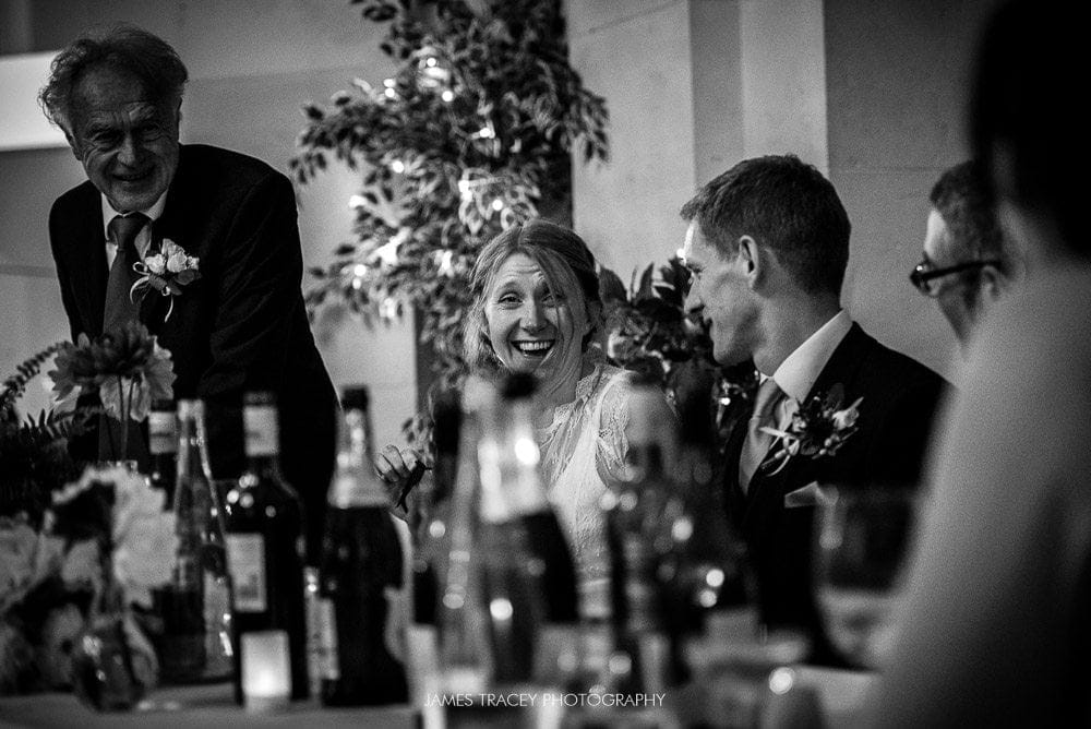 wedding couple laughing in their speeches