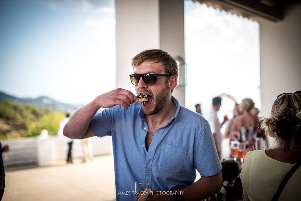 guest eating canapes at elixir shore club