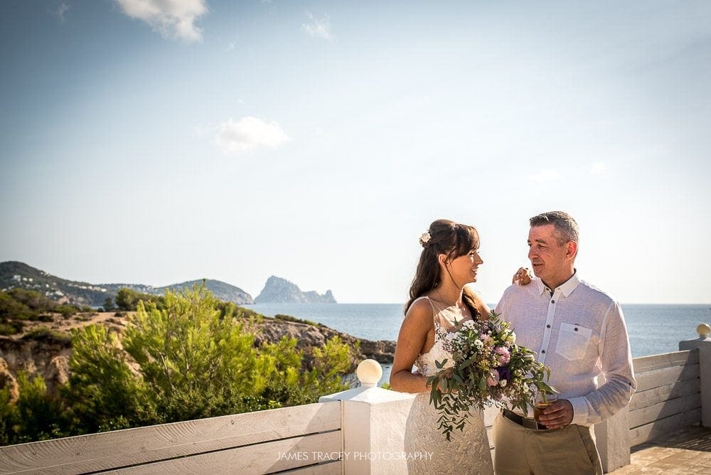 bride and groom with view of ibiza