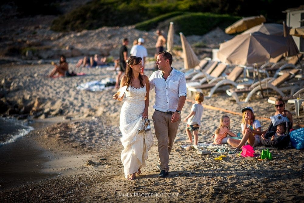 bride and groom walking on ibiza beach