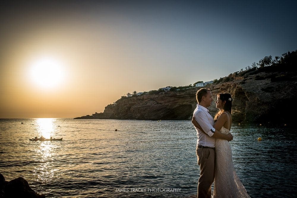 wedding couple in from of setting Ibiza sun