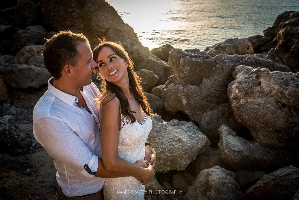 wedding couple in rocks in ibiza