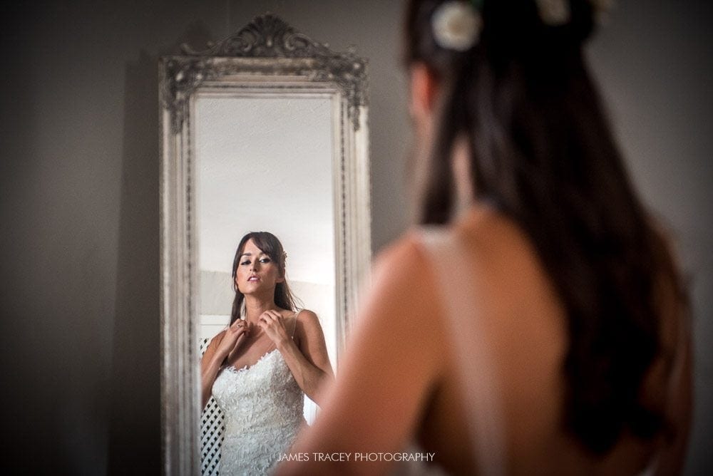 bride getting in her dress