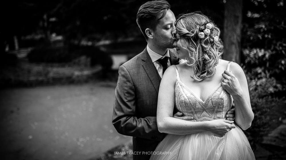 groom kissing his wife