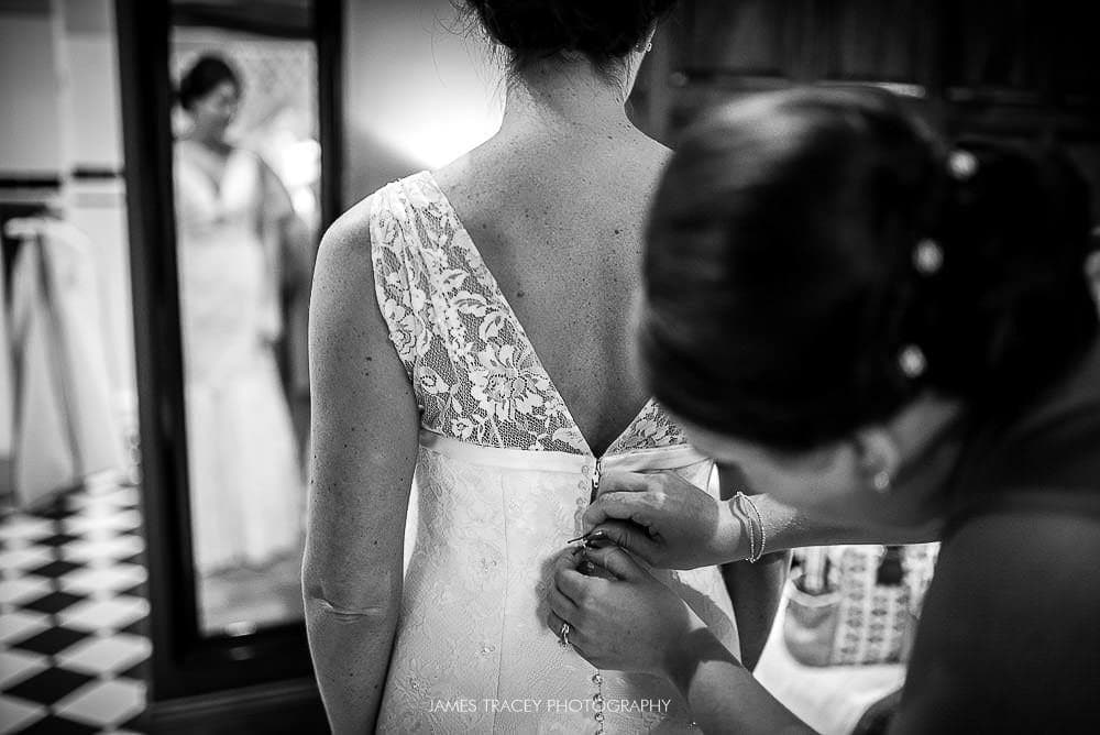 bride getting in her dress