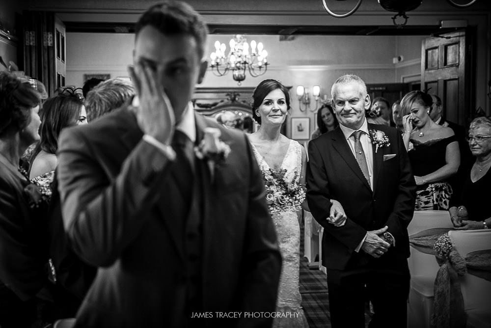 groom crying at wedding