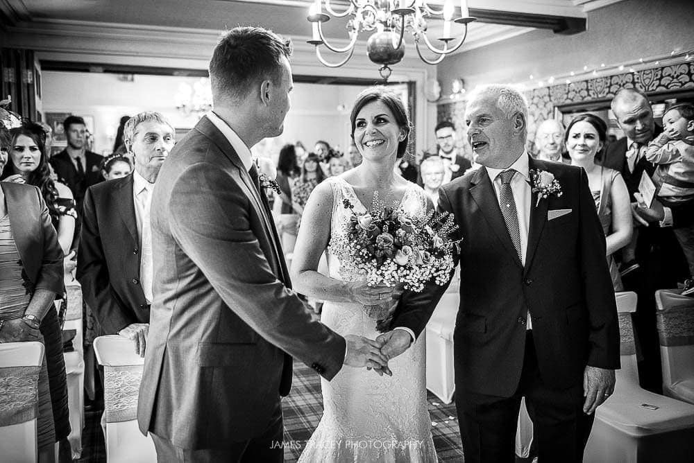 father of the bride shaking grooms hand