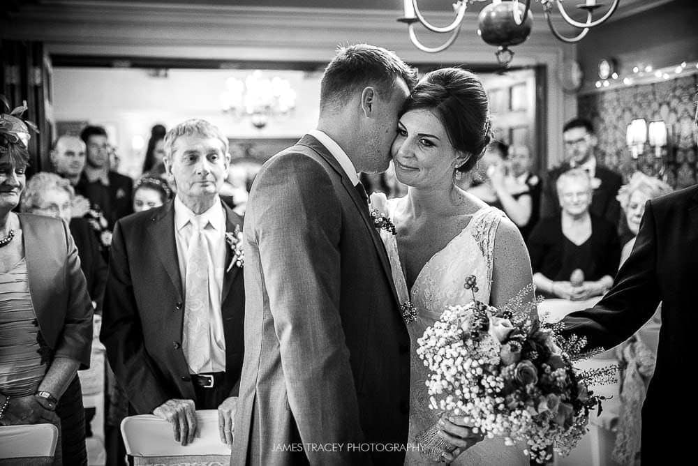 groom kissing bride