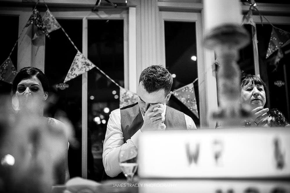 groom wiping a tear away