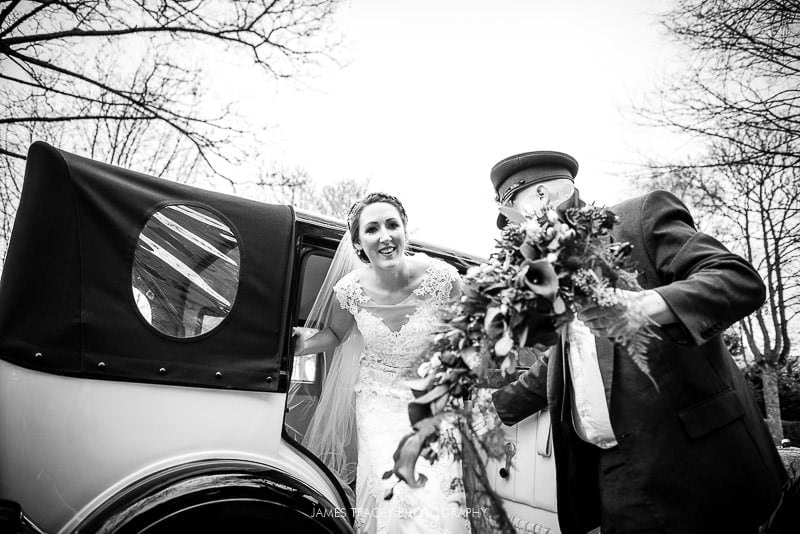 bride getting out of wedding car