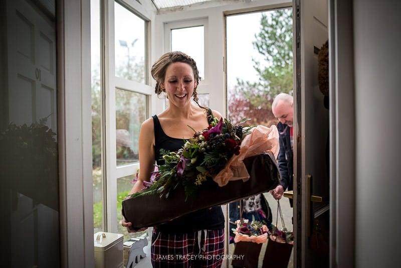 bride getting her wedding flowers