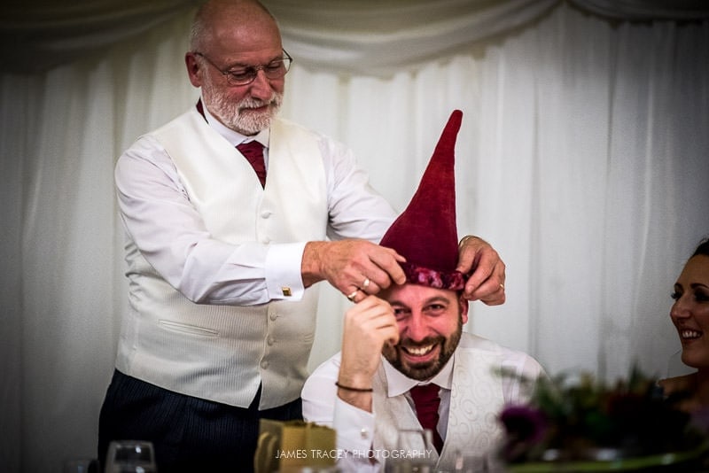 groom made to wear a daft hat