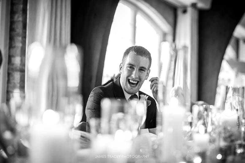 groom laughing at speech