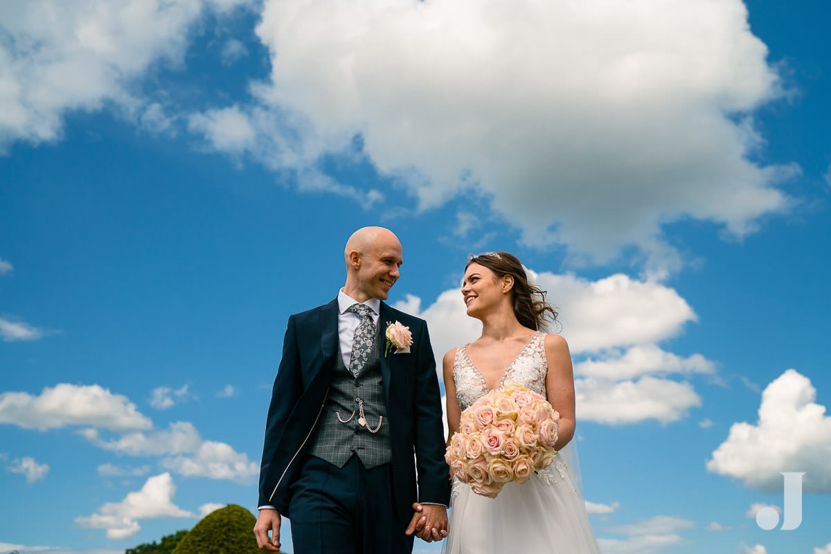 bride and groom and clouds