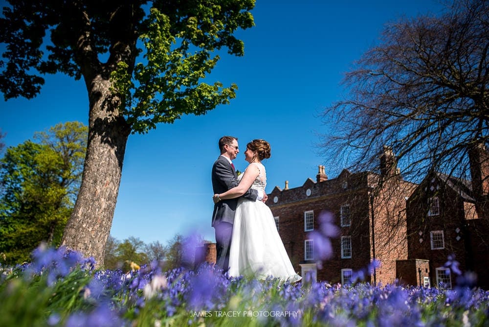 bride and groom in front of meols hall